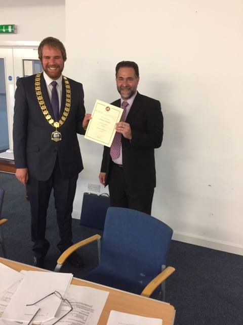 Pictured is the Chairman, Councillor David Jowett presenting the award to the Clerk, Andrew Sharpe at a meeting earlier this evening.